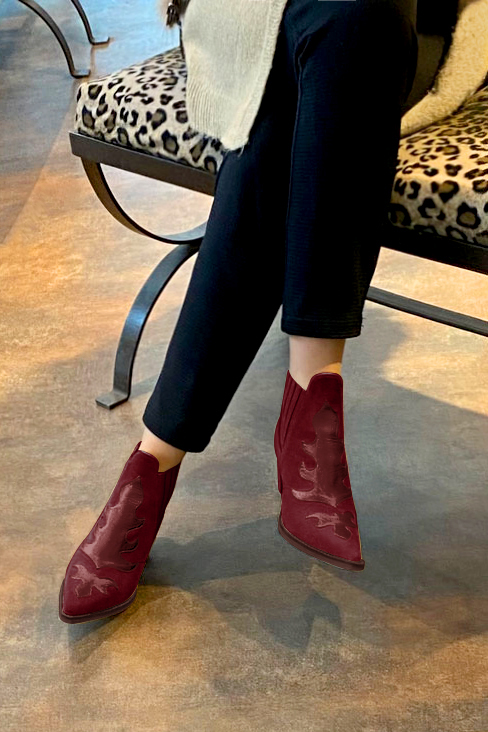 Burgundy red women's ankle boots, with elastics. Pointed toe. Medium cone heels. Worn view - Florence KOOIJMAN